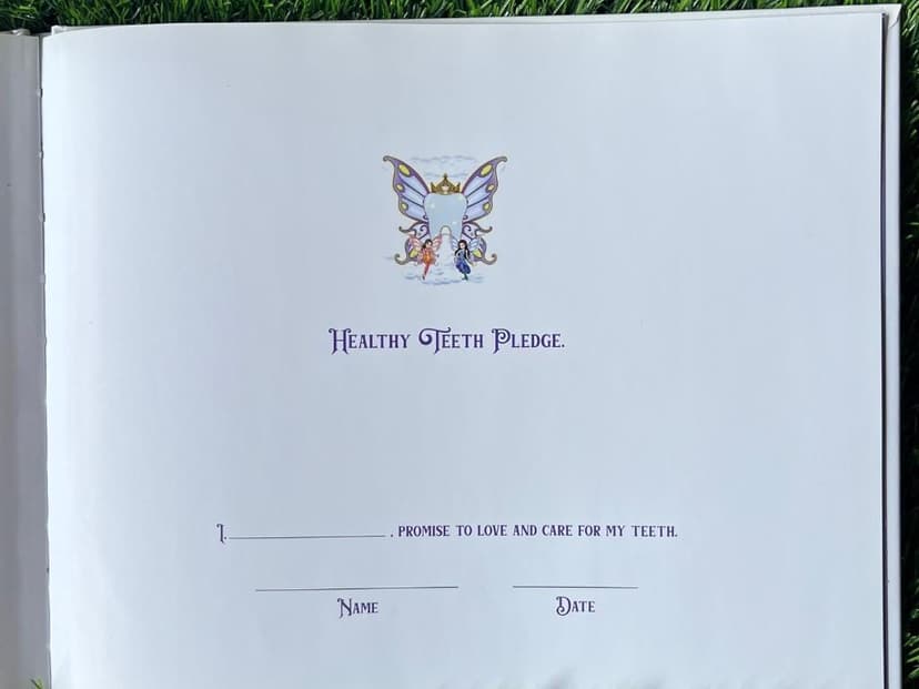 Healthy Teeth Pledge page from the Adventures of the Tooth Fairy children's book, with a fillable name and date for kids to sign